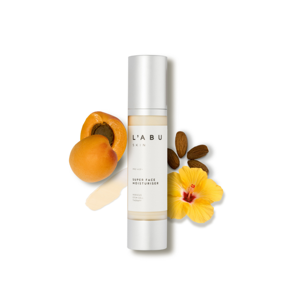 Age Pro+ Moisturiser bottle surrounded by apricot halves, grapes and flowers